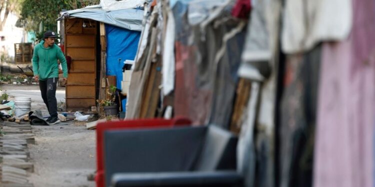 Migrantes asentados en campamento en Ciudad de México